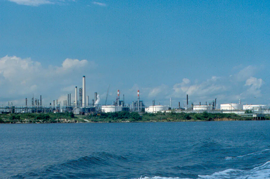 Refinery structures across the water in Deer Park