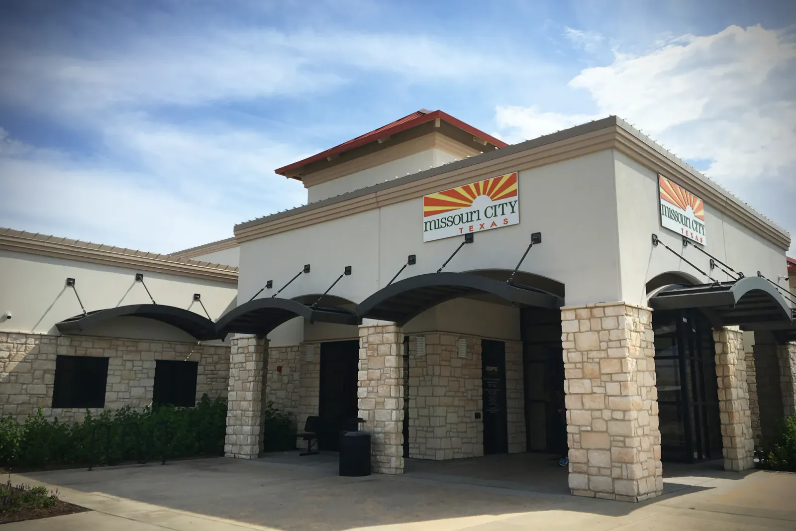 Low commercial building with an arched entrance