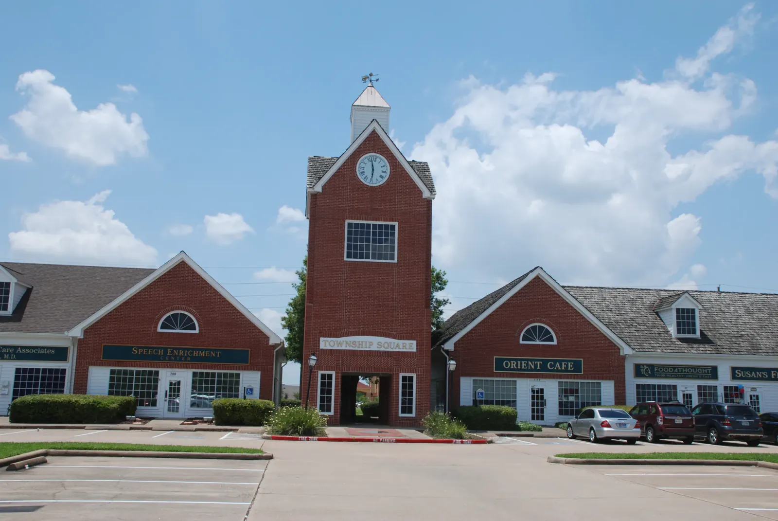 Red-brick civic building with a clock tower