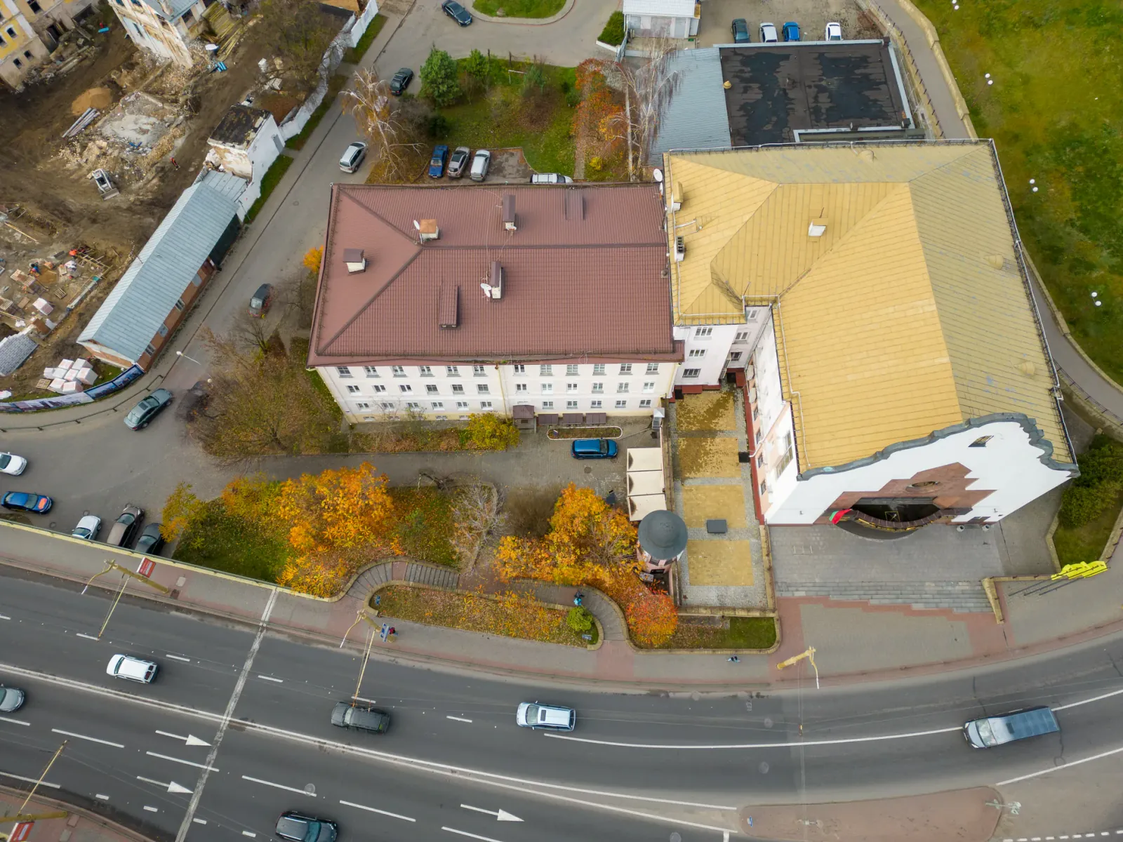 Aerial view of low commercial buildings and a road