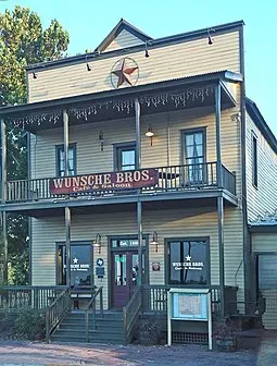 Two-story shopfront with balconies in Spring