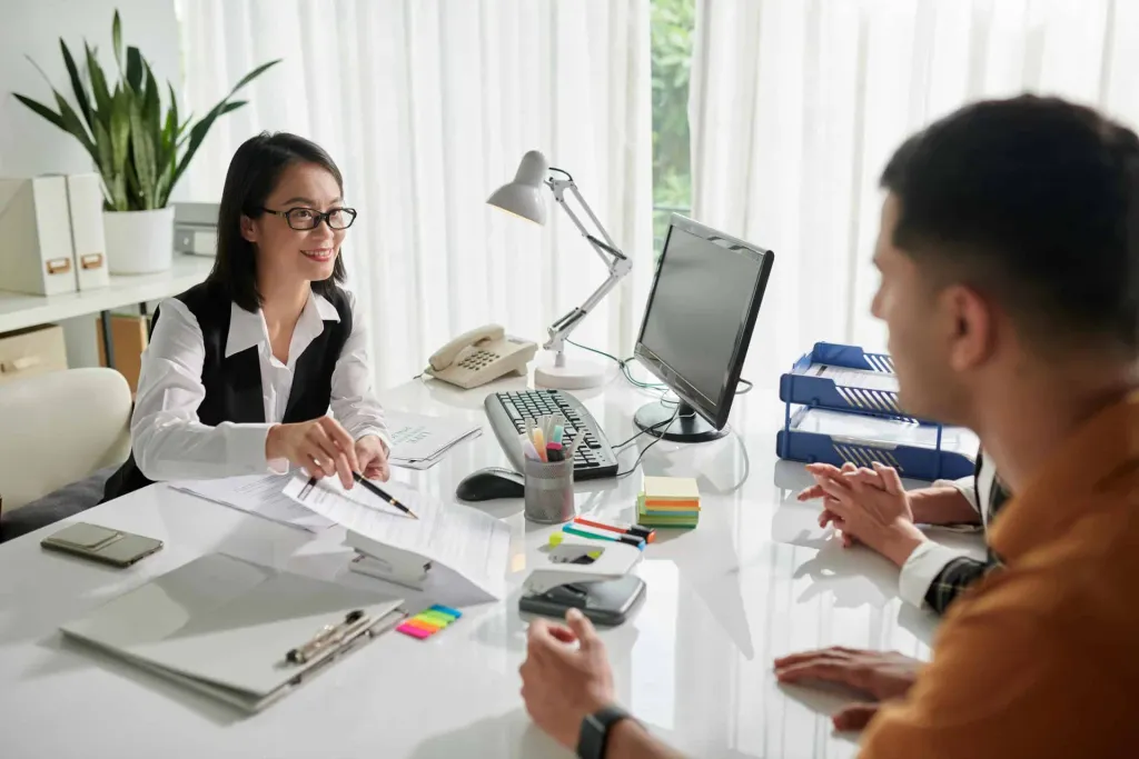 An insurance adviser helping a couple review their options