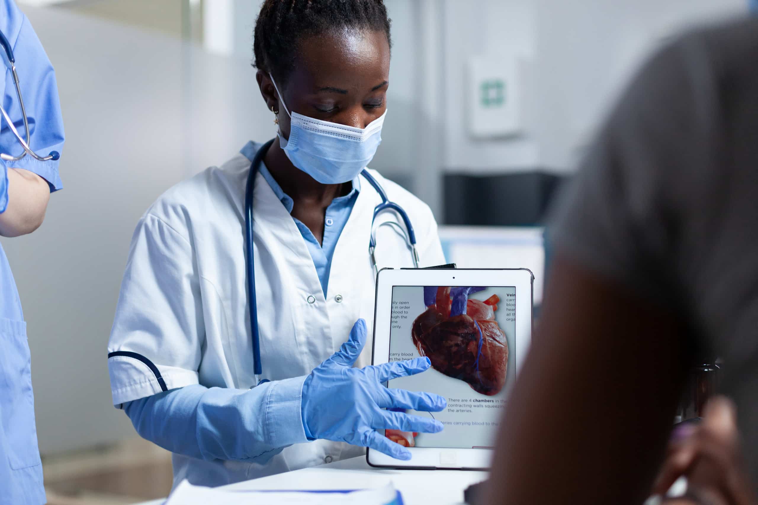 A nurse is analyzing a patient's x-ray for signs of heart disease and assessing the risk level.