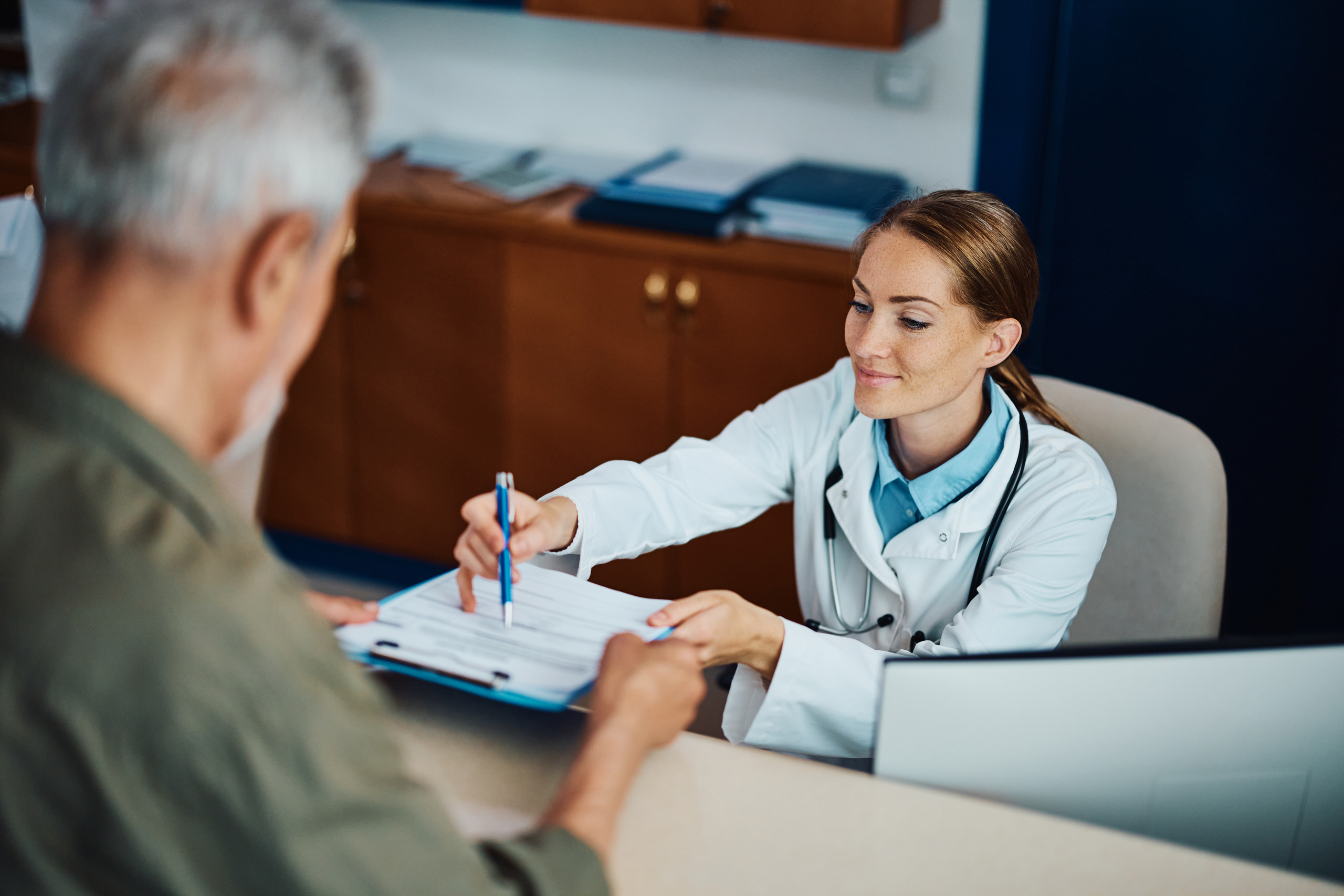 A doctor informs a patient about their COBRA insurance rights during a doctor's visit.