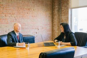 Business owner consulting with a health insurance broker in Houston