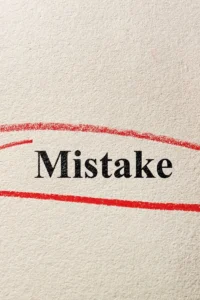 Image of the word “mistake,” representing common errors employers make when choosing group health insurance in Houston.